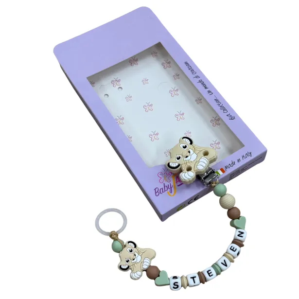 Babyjart Chaîne de tétine PRESTIGE LION en silicone avec nom, crochet / adaptateur de tétine MAM et CHICCO
